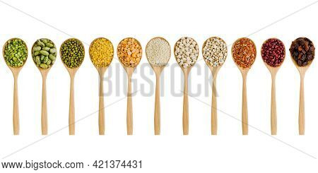 Collection Of Dry Organic Cereal And Grai Seeds In Wooden Spoon On White Background
