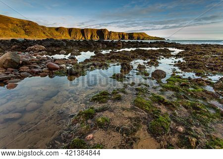 View Of The Coastline With Cliff And Beach At Castle Haven, Dunnottar Castle Area.stonehaven, Aberde