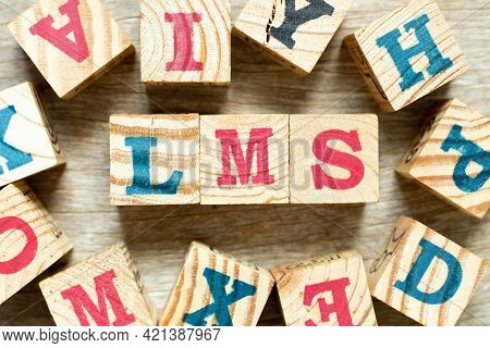 Alphabet Letter Block In Word Lms (abbreviation Of Learning Management System) With Another On Wood 