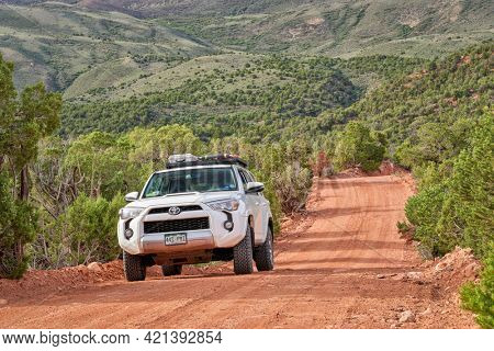 Dinosaur National Monument, CO, USA - May 18, 2021: Toyota 4Runner SUV (2016 Trail model) on a dirt backcountry road, Yampa Bench Road, springtime morning scenery.