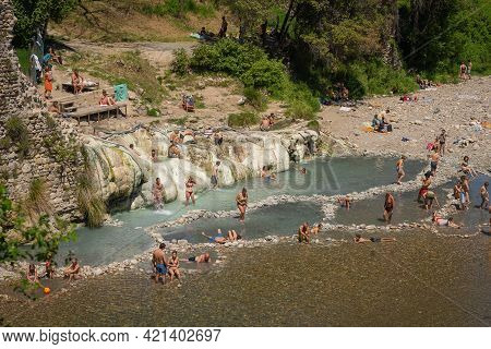 People Bathing In Pools Of Thermal Spring Bagni Di Petriolo In Siena, Tuscany, Italy