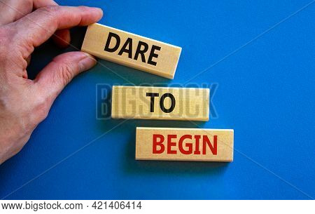 Dare To Begin Symbol. Wooden Blocks With Words 'dare To Begin'. Beautiful Blue Background, Businessm