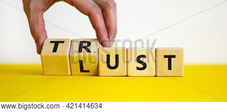Lust Or Trust Symbol. Businessman Turns Wooden Cubes And Changes The Words 'lust' To 'trust'. Beauti