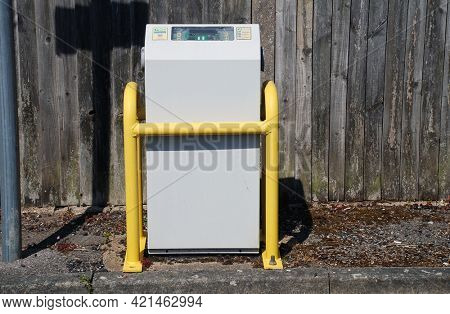 TENTERDEN, ENGLAND - APRIL 26, 2021: An electric vehicle charging unit in a car park at Tenterden in Kent. Sales of diesel and petrol vehicles will be phased out by 2030 in the UK.