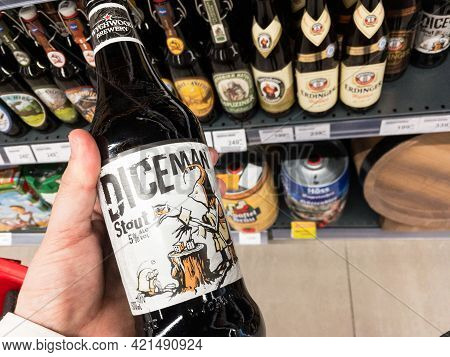 Belgrade, Serbia - May 12 2021: Hands Holding A Bottle Of Diceman Stout Beer Produced By Wychwood. W