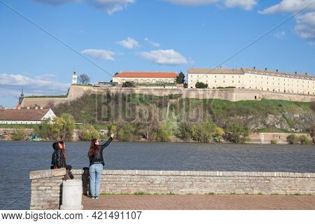 Novi Sad, Serbia - March 23, 2017: Girls, Friends Sitting Together And Taking A Selfie In Front Of P