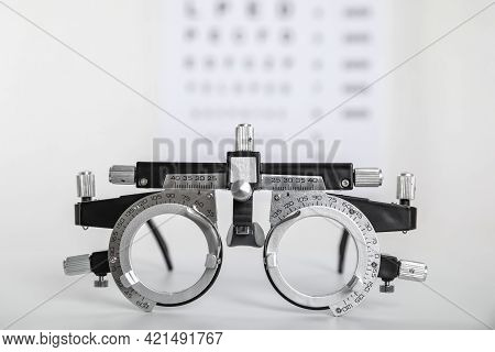 Trial Frame On Light Background, Closeup. Ophthalmologist Tool