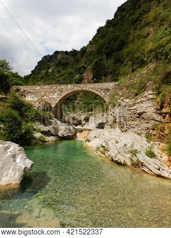Stone Bridge In The Nervia Valley View Near The Rio Barbaira Stream, Rocchetta Nervina, Liguria - It