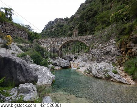 Stone Bridge In The Nervia Valley View Near The Rio Barbaira Stream, Rocchetta Nervina, Liguria - It