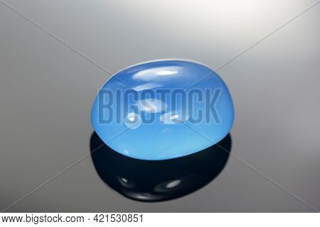 Natural Blue Chalcedony Irregular Oval Cabochon Polished Gemstone. Heated, Color Enhanced, Increased