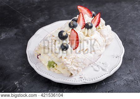 Mereng Cake With Fresh Berries And Fruits. Strawberries, Kiwi, Blackberries. Protein Dessert In Whit