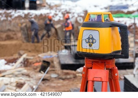 Laser Rangefinder At A Construction Site. Measuring Tool At A Construction Site. Accurate Constructi