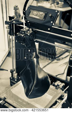 3d Printer Printing A Model In The Form Of Black Vase Close-up.