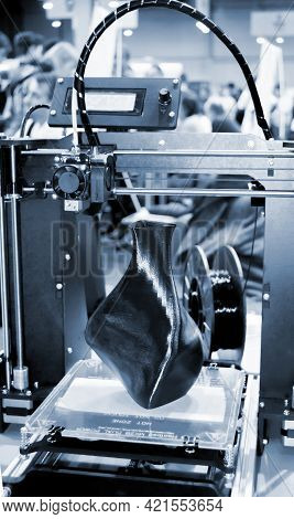 3d Printer Printing A Model In The Form Of Black Vase Close-up.