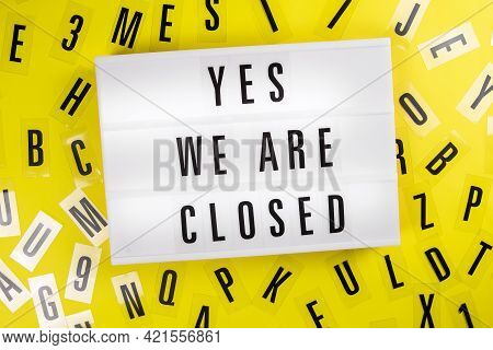 Lightbox With Text Yes. We Are Closed On Yellow Background With Black Letters Randomly Scattered. Co