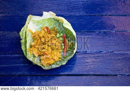 Spicy Cabbage Leaves Cuisine Dish In A Cabbage Leaves Isolated On Blue Wooden Background With Copy S