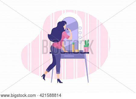 Stylish Girl Does Makeup Near Mirror. Young Woman Paints Lips And Applies Foundation To Face. Routin