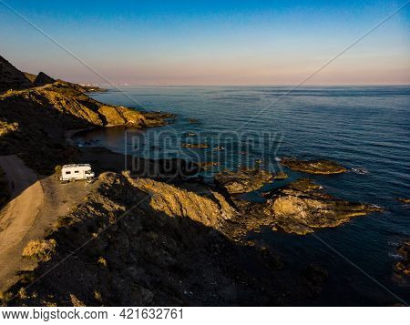 Spanish Rocky Coastline With Camper Car Camping On Cliff Sea Shore. Mediterranean Region Of Villaric