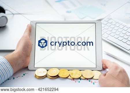 Russia Moscow 06.05.2021.businessman With Tablet.logo Of Cryptocurrency Stock Exchange Crypto.com.tr