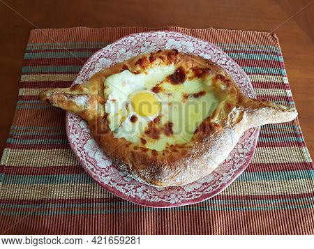 Delicious Fresh Khachapuri Prepared For Lunch By A Grandmother In The Village.