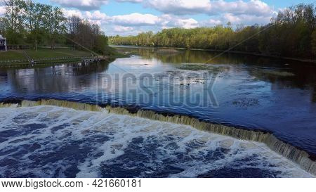 Flying Fish At Ventas Rumba Waterfall. The Widest Waterfall In Europe In Latvia Kuldiga Also Called 