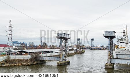 Kaliningrad, Russia - April 15, 2021: Ruins Of The Old Railway Bridge On The Pregolya River, Industr