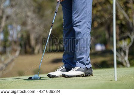 Golfers Are Putting Golf In The Evening Golf Course Golf Backglound. Golfer Hitting Golf Ball. Sport