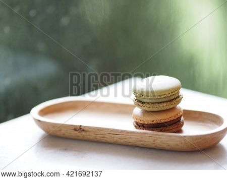 Macaron Flavor Green Tea And Coffee In Wooden Tray Plate Shape Ellipse, Dessert Snacks Afternoon On 