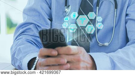 Composition of network of medical icons over male doctor using smartphone. global online medicine and technology concept digitally generated image.