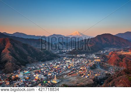 Otsuki, Japan Skyline with Mt. Fuji at twilight.