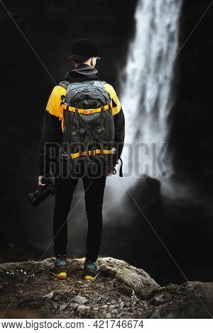 Photographer at the Haifoss waterfall, Iceland
