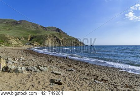 An Empty Sandy Beach In Kapsel Bay At The Foot Of Cape Meganom. Off-season. Crimea, End Of April.