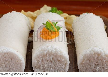 White Raw Rice Puttu/pittu_wooden Background