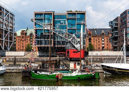 Hamburg, Germany - August 7, 2019: Cityscape Of Sandtorhafen Canal With Ships Moored On The Harbour 