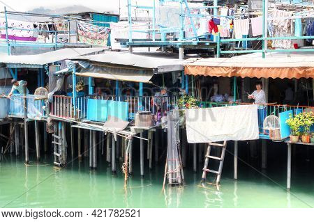 Hong Kong-apr. 10, 2011: Residents Of Tai O Fishing From Their Houses On Stilts Above The Tidal Flat