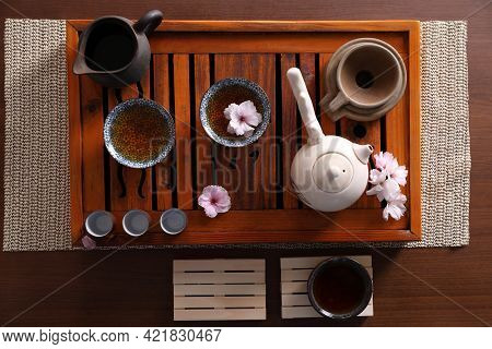 Beautiful Set For Traditional Tea Ceremony On Wooden Table, Flat Lay