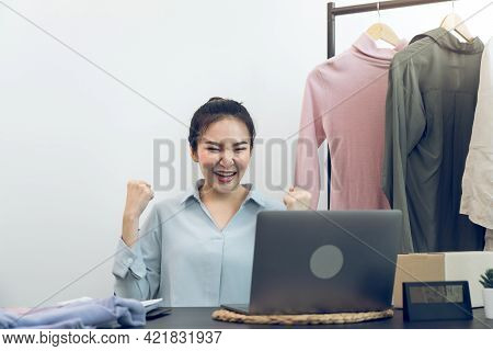 Young Asian Entrepreneurs Are Excited About Hitting Today's Clothing Sales Target.