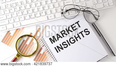 Text Market Insights .workspace With Keyboar, Notebook Sketchbook, Chart On White Background.