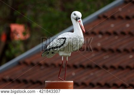 Plastic Stork Serves As A Decoration In The Garden