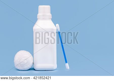 Plastic Bottle For Hydrogen Peroxide, Blue Background, Medicine Concept, With Copy Space