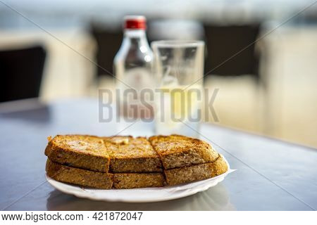 Tasty Toast With Salted Butter On The Outdoor Table In Algarve, Portugal