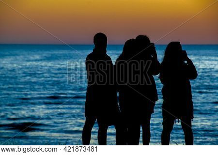 People At Beach Sunset Silhouette Scene