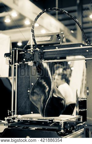 3d Printer Printing A Model In The Form Of Black Vase Close-up.