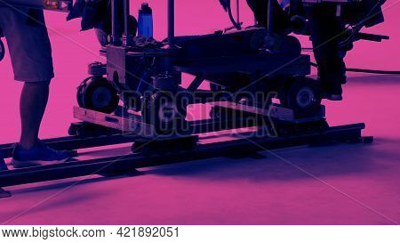 Dolly Track Setting Up By Film Crew Man. Behind The Scene Of Video Production