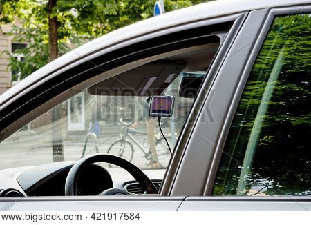 Paris, France - May 24, 2017: Tomtom Gps Unit On The Car Dashboard View Through The Open Window Of A