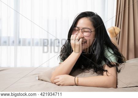 Beautiful Glasses Asian Woman Feels Embarrassed And Smiles To The Camera And Lays Down On Her Bed  I