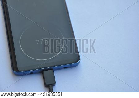 Overhead View Of A Smartphone Connected With Usb Type-c Charging Cable With Negative Space, Mobile P