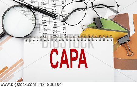 Text Capa On White Paper Notebook On Diagram. Business Concept