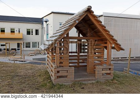 Umea, Norrland Sweden - May 3, 2021: Small Wooden Playhouse At A School On Teg