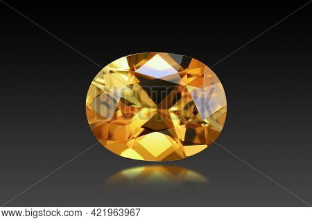 Natural Golden Yellow Loose Tourmaline Oval Faceted Gemstone. Dark Background Isolated. Reflection, 
